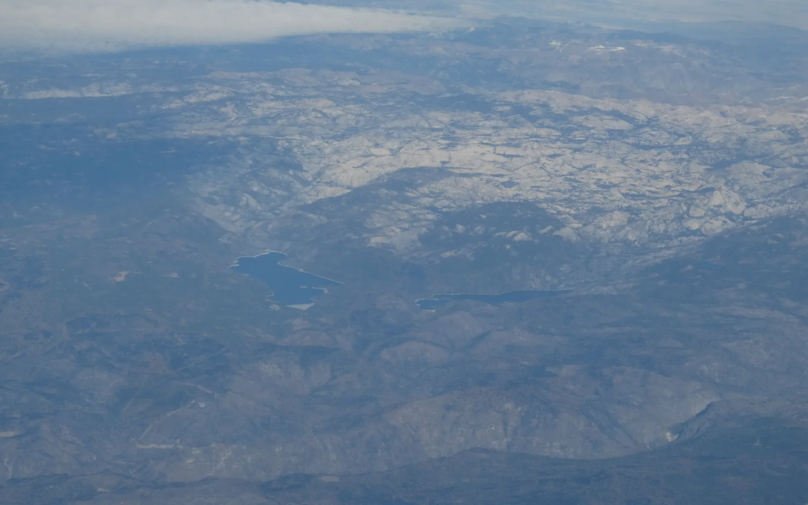 Sierra Nevada mountain foothills showing the transition zone between the Central Valley and the Sierra range, with blue oak woodland and mountain backdrop